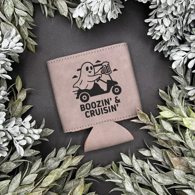 Engraved Gray can koozie engraved with ghost riding on golf cart with the words Boozin' & Cruisin'
