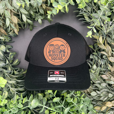 Patch engraved with Monster Squad font. Frankenstein, mummy, and vampire.