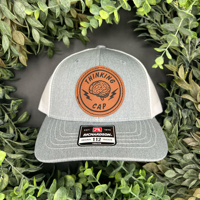 Engraved patch with Thinking Cap written and brain with bolts 